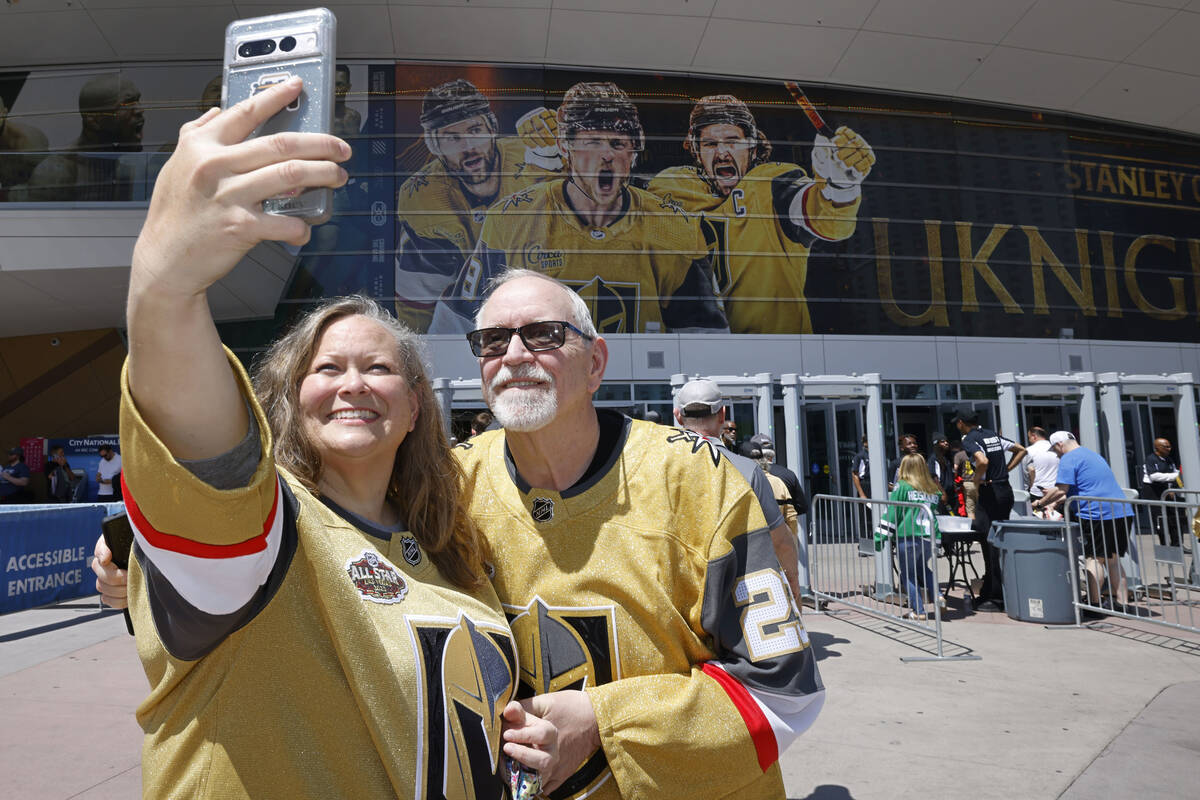 Golden Knights fans Melissa Brown of Ely, Nev., and her husband Kelly take a selfie before the ...