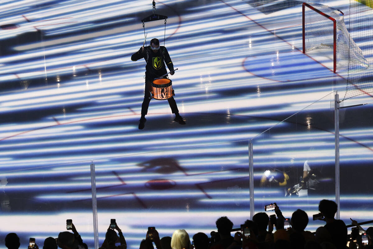 A member of the Vegas Golden Knights Knight Line by Drumbots performs before the Game 2 of the ...