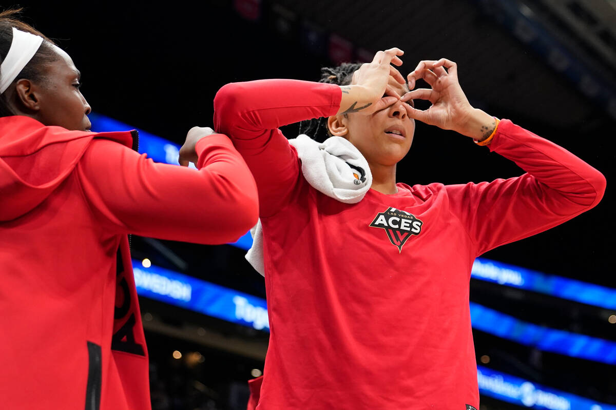 Las Vegas Aces guard Chelsea Gray, left, and forward Candace Parker, right, celebrate a basket ...