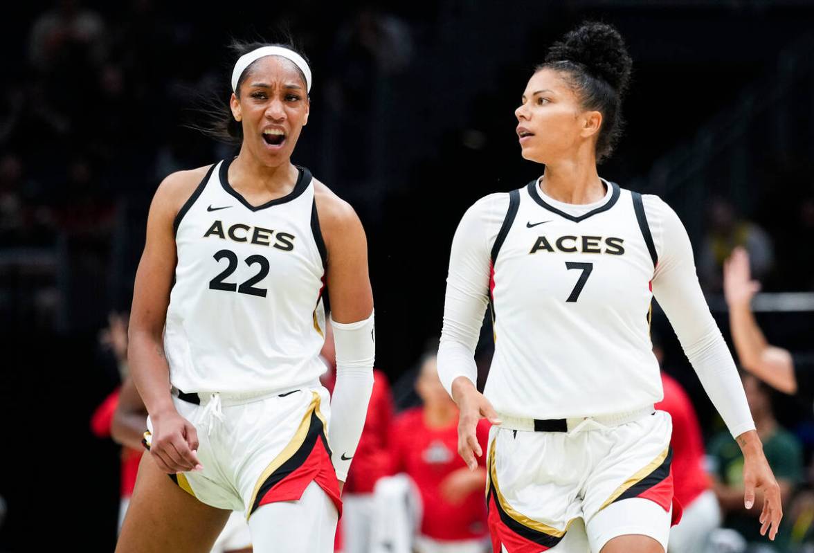 Las Vegas Aces forward A'ja Wilson (22) reacts with forward Alysha Clark (7) during the second ...