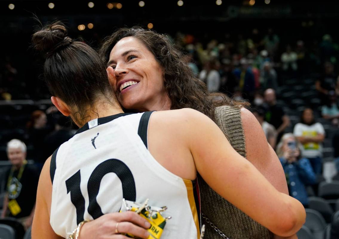 Las Vegas Aces guard Kelsey Plum (10) hugs former Seattle Storm guard Sue Bird after a WNBA bas ...