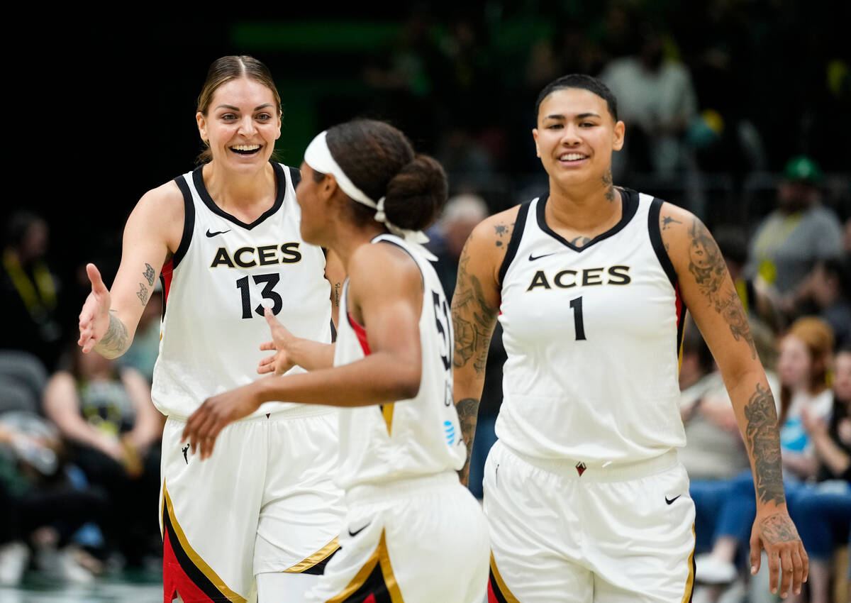 Las Vegas Aces forward Cayla George (13) celebrates a 105-64 win over the Seattle Storm with te ...