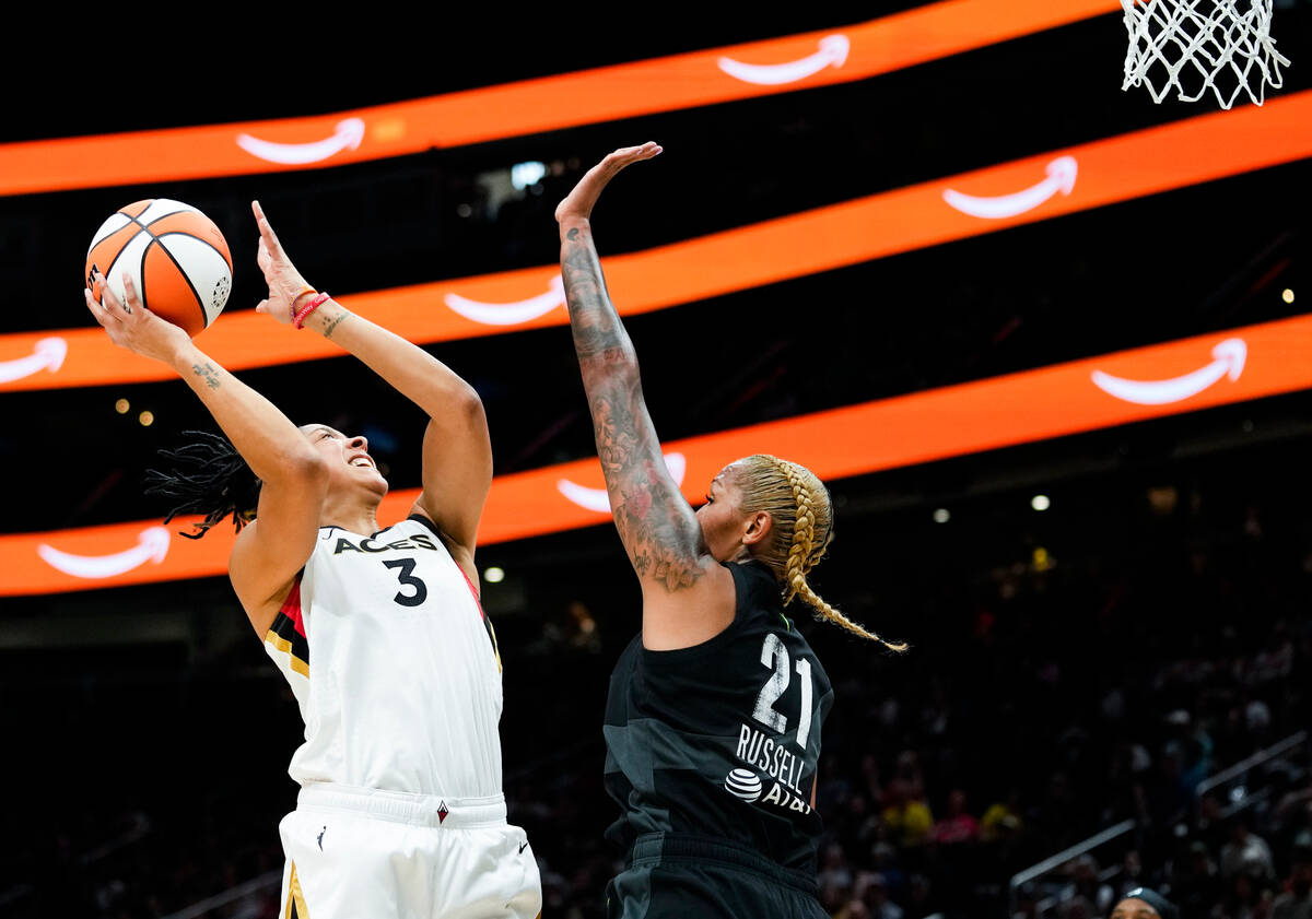 Las Vegas Aces forward Candace Parker (3) shoots over Seattle Storm center Mercedes Russell (21 ...