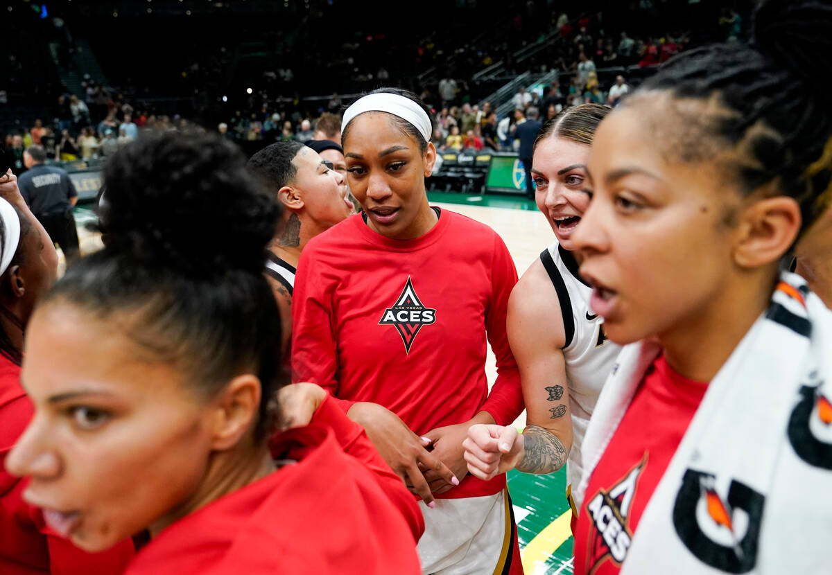 The Las Vegas Aces, including forward Alysha Clark, left, guard Kierstan Bell, forward A'ja Wil ...