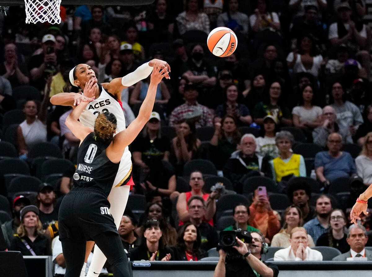 Las Vegas Aces forward A'ja Wilson (22) blocks the shot of Seattle Storm guard Kia Nurse (0) du ...