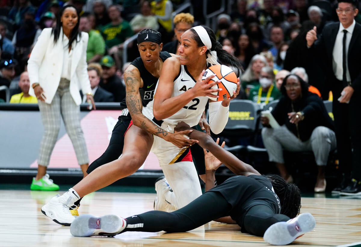 Las Vegas Aces forward A'ja Wilson (22) looks to pass the ball away during a scrum with Seattle ...