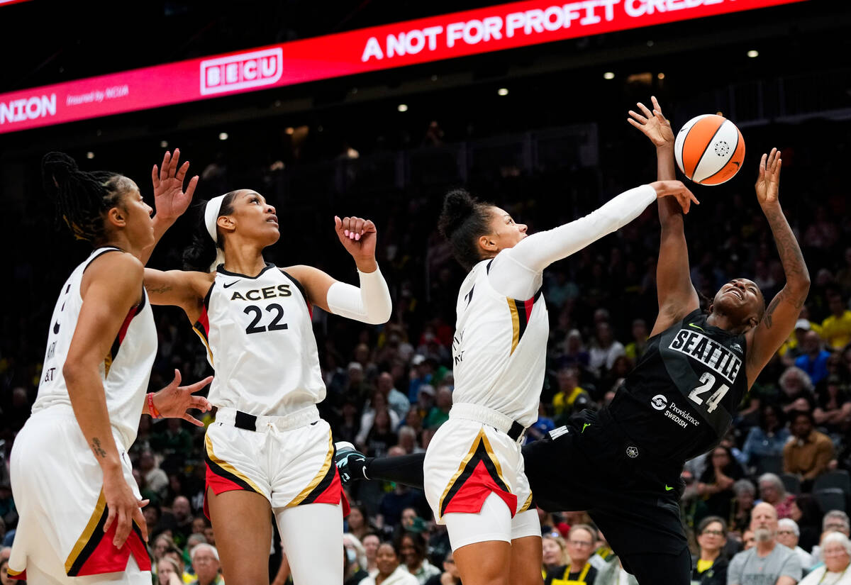 Seattle Storm guard Jewell Loyd (24) has her shot blocked by Las Vegas Aces forward Alysha Clar ...