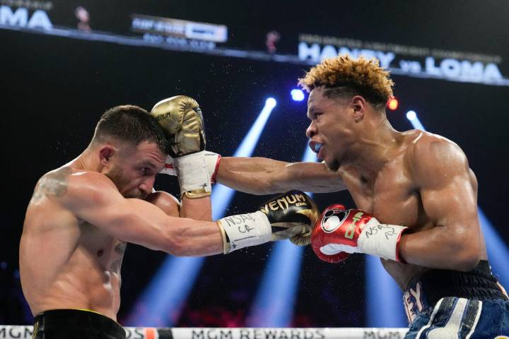 Devin Haney, right, fights Vasiliy Lomachenko in an undisputed lightweight championship boxing ...