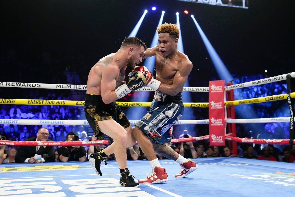 Devin Haney, right, fights Vasiliy Lomachenko in an undisputed lightweight championship boxing ...