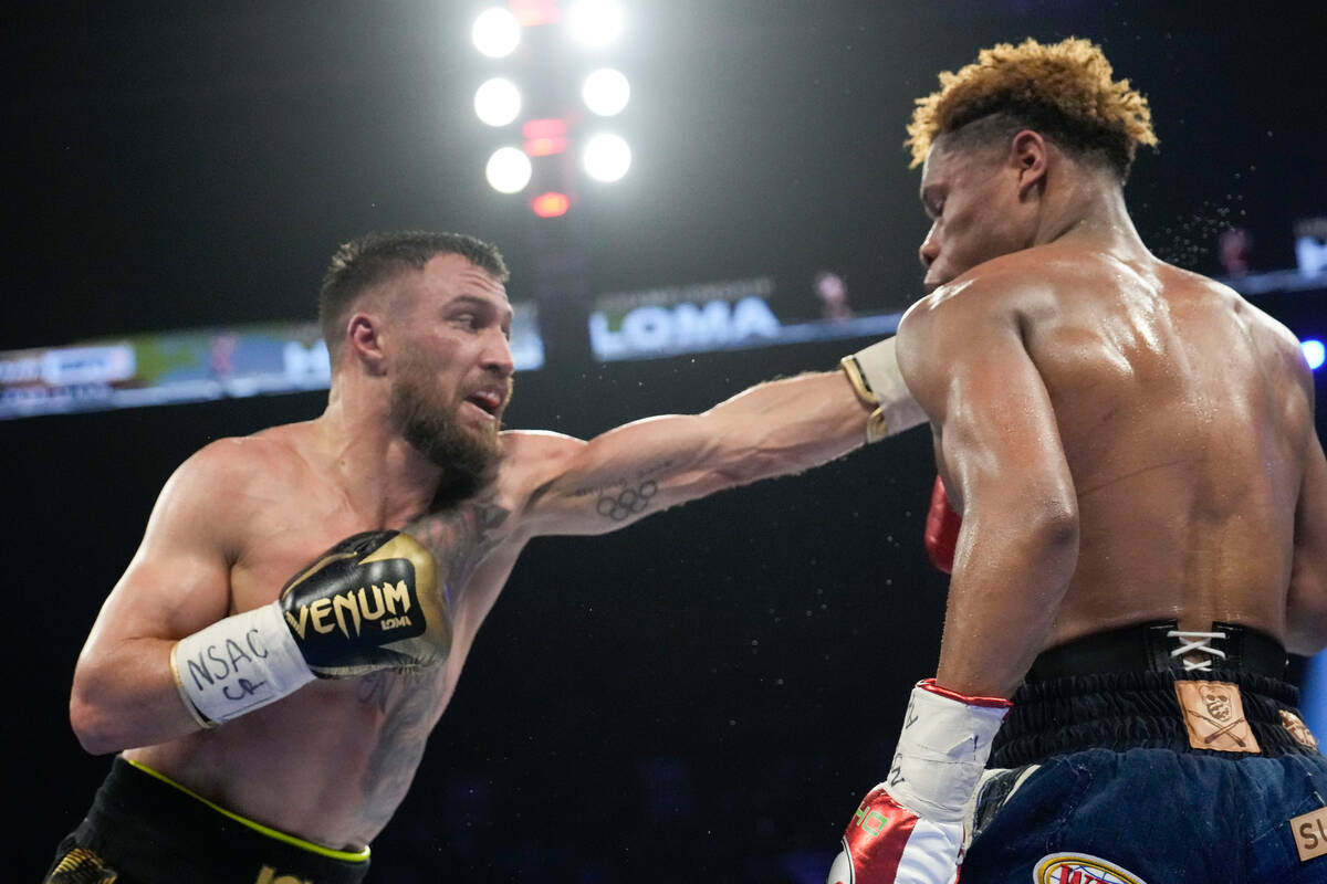 Devin Haney, right, fights Vasiliy Lomachenko in an undisputed lightweight championship boxing ...
