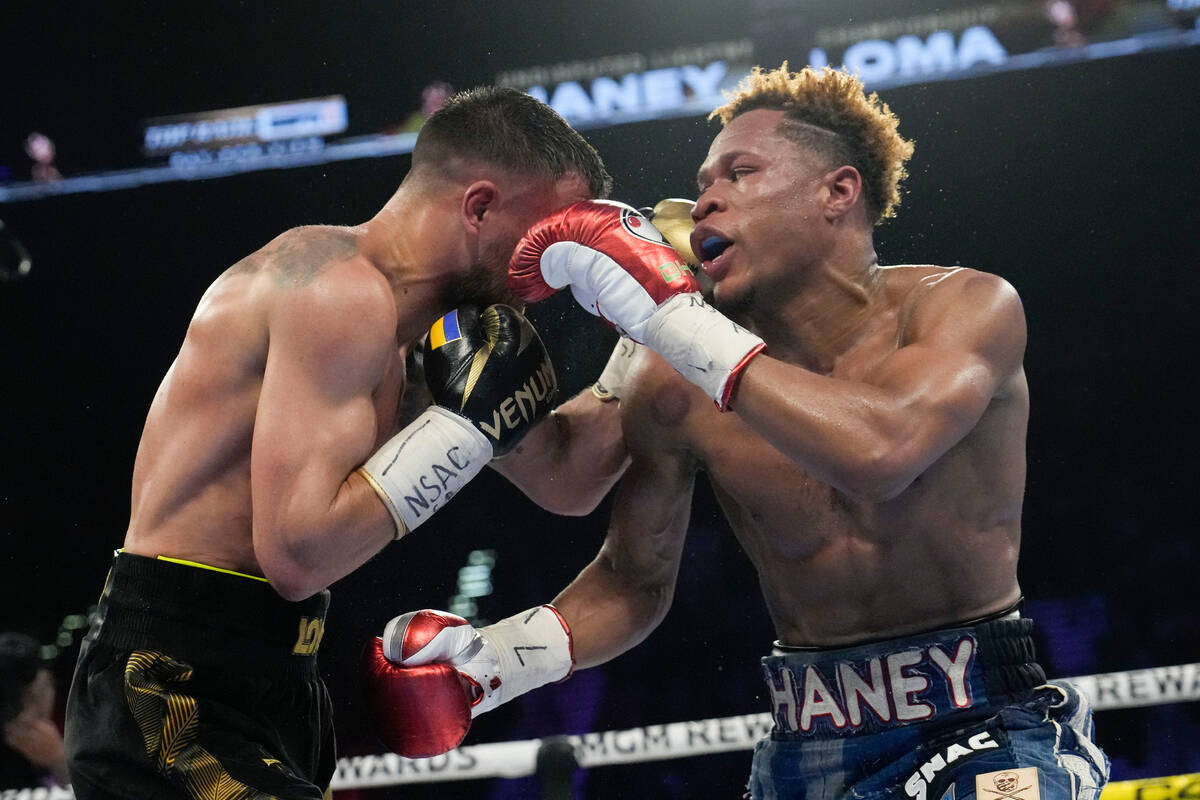 Devin Haney, right, fights Vasiliy Lomachenko in an undisputed lightweight championship boxing ...