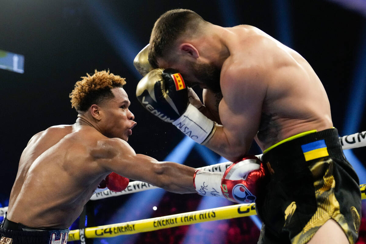 Devin Haney, left, fights Vasiliy Lomachenko in an undisputed lightweight championship boxing m ...