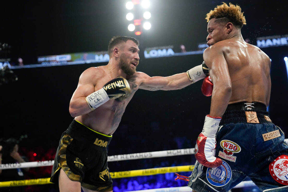 Devin Haney, right, fights Vasiliy Lomachenko in an undisputed lightweight championship boxing ...