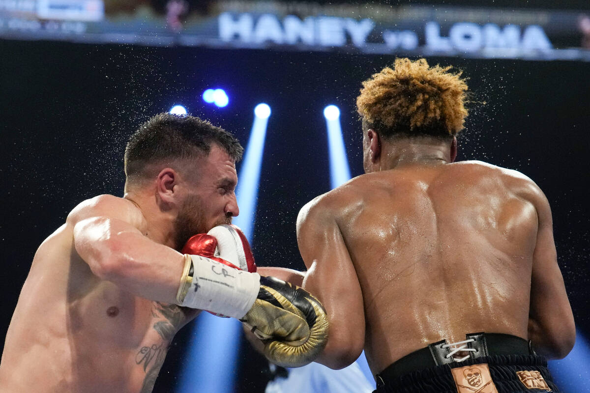 Devin Haney, right, fights Vasiliy Lomachenko in an undisputed lightweight championship boxing ...