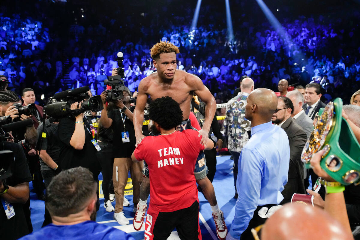 Devin Haney celebrates after defeating Vasiliy Lomachenko in an undisputed lightweight champion ...