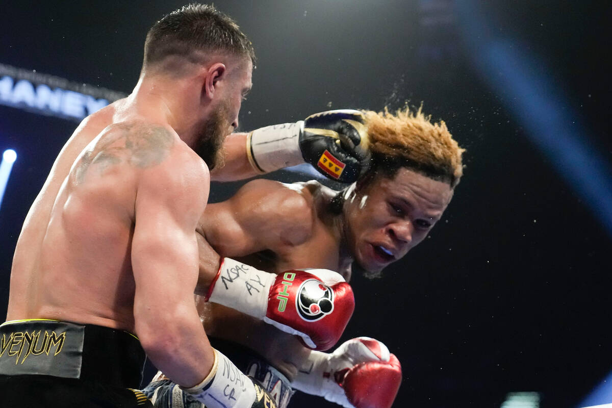 Devin Haney fights Vasiliy Lomachenko, left, in an undisputed lightweight championship boxing m ...