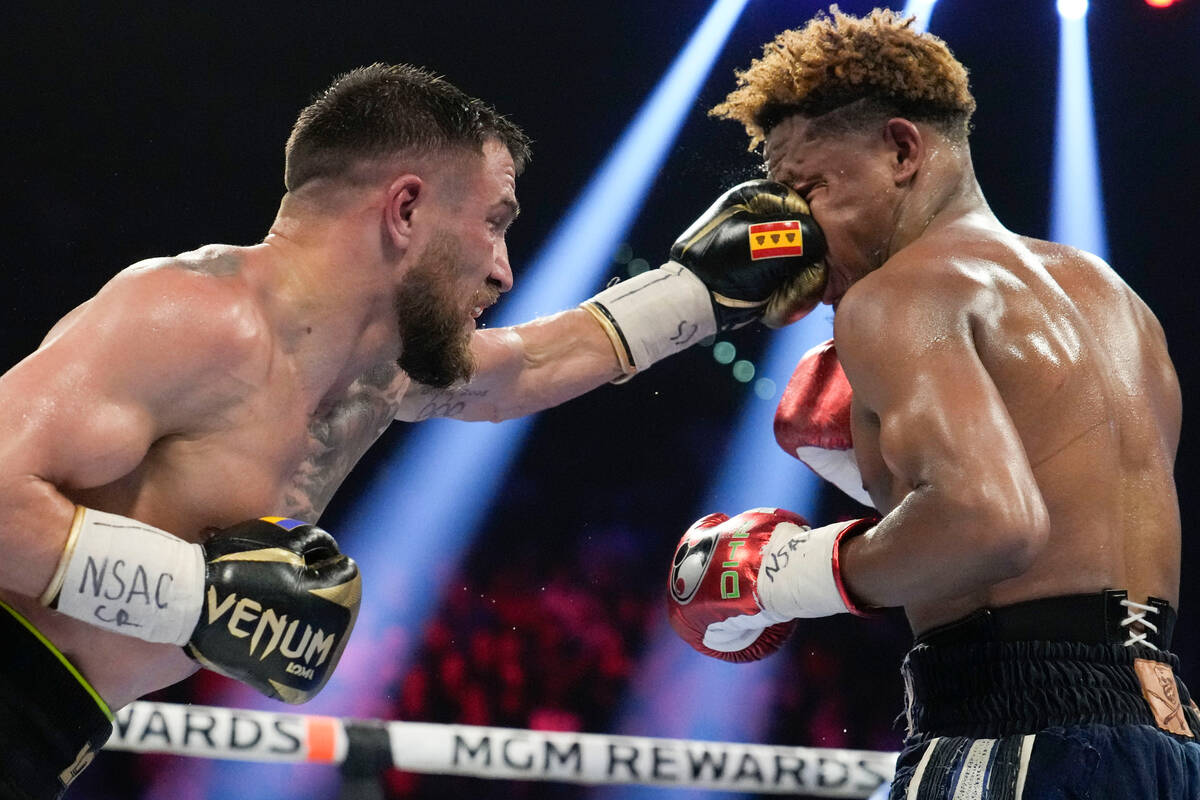Devin Haney, right, fights Vasiliy Lomachenko in an undisputed lightweight championship boxing ...