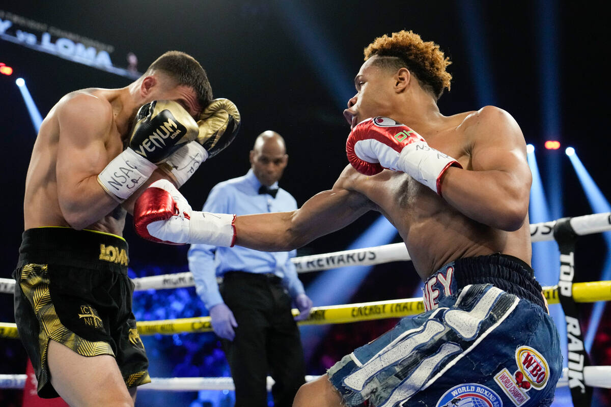Devin Haney, right, fights Vasiliy Lomachenko in an undisputed lightweight championship boxing ...