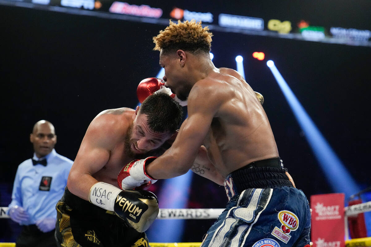 Devin Haney, right, fights Vasiliy Lomachenko in an undisputed lightweight championship boxing ...