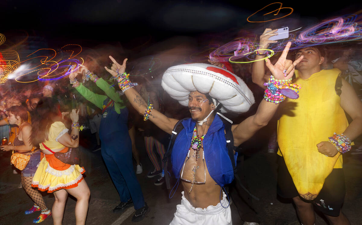 An attendee who identified themself as Mxguelaxgel dances during the second day of electronic d ...