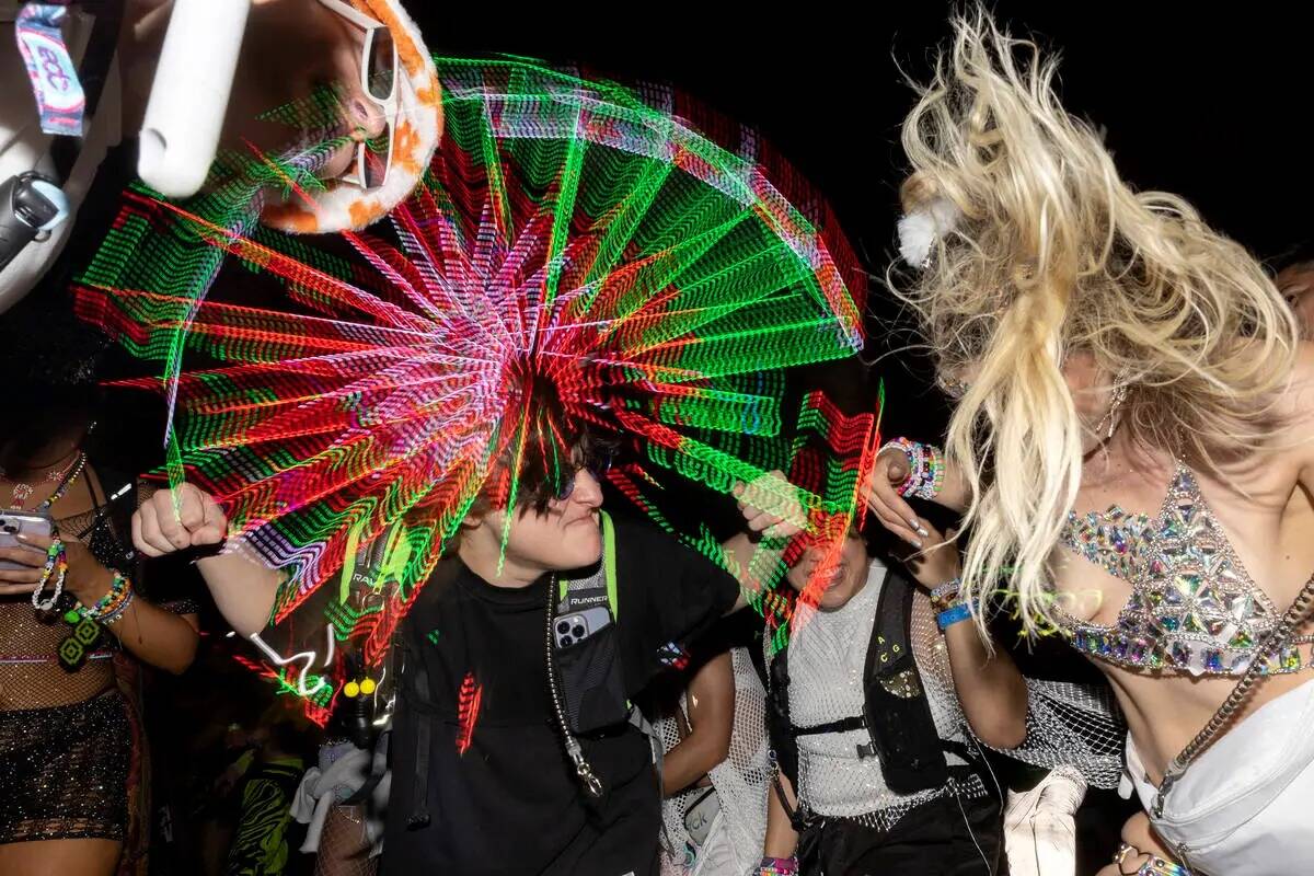Attendees dance to electronic music during the second day of Electric Daisy Carnival on Saturda ...