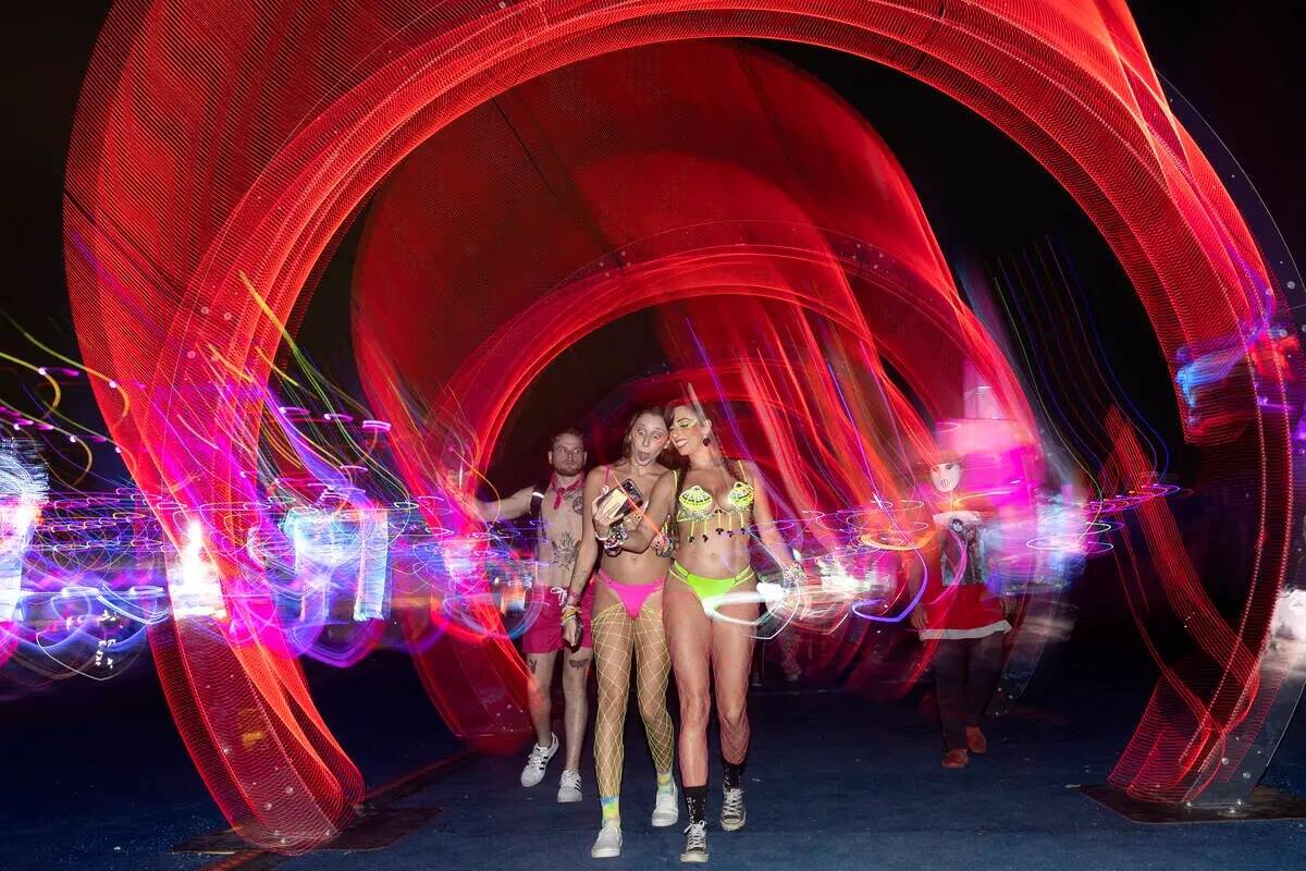 Attendees take selfies during the second day of the Electric Daisy Carnival electronic music fe ...