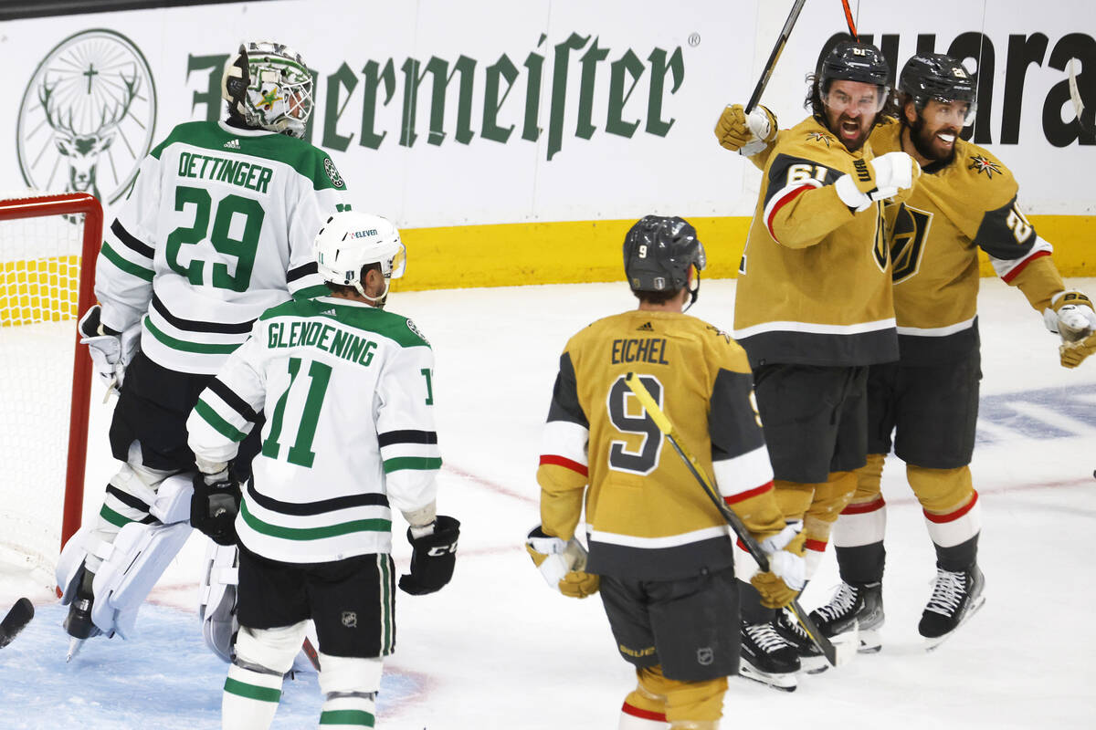 Golden Knights defenseman Dysin Mayo (61) celebrates with his tameamates Golden Knights center ...