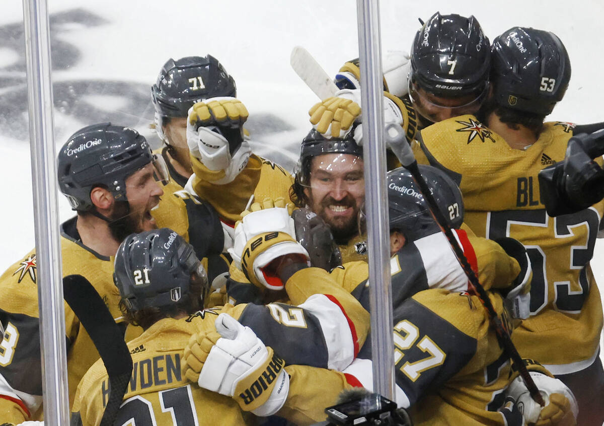 Golden Knights right wing Mark Stone (61), center, celebrates their 3-2 victory against Dallas ...