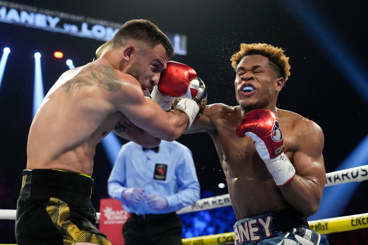 Devin Haney, right, fights Vasiliy Lomachenko in an undisputed lightweight championship boxing ...