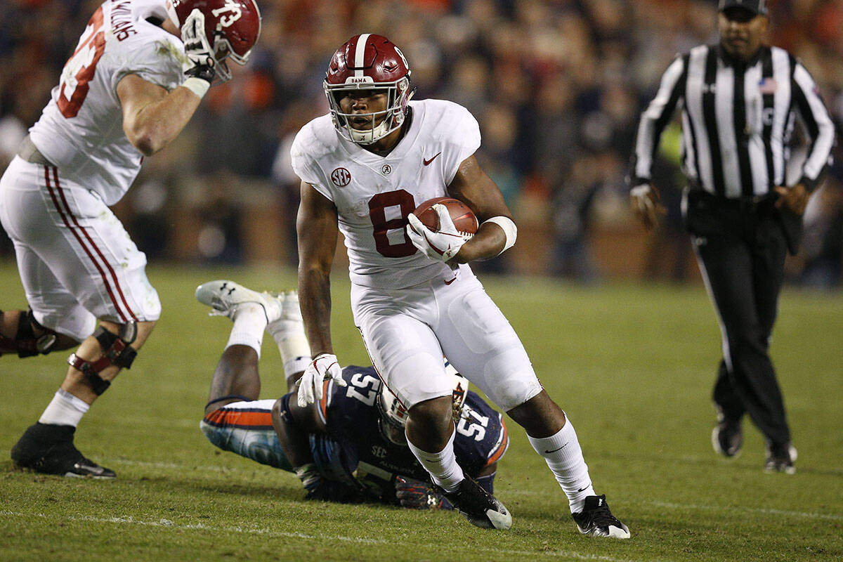 Alabama running back Josh Jacobs (8) runs the ball during the second half of the Iron Bowl NCAA ...