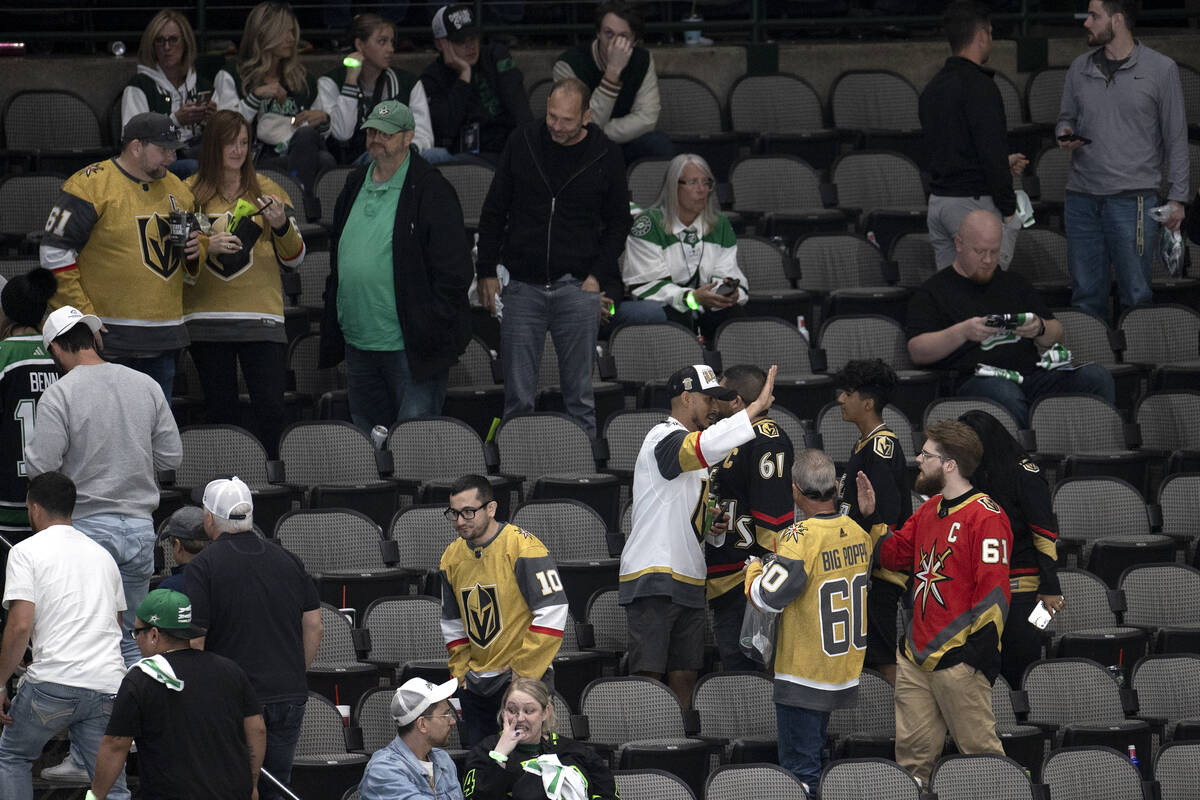 Golden Knights fans celebrate a win while Dallas Stars fan leave the arena after Game 3 of the ...