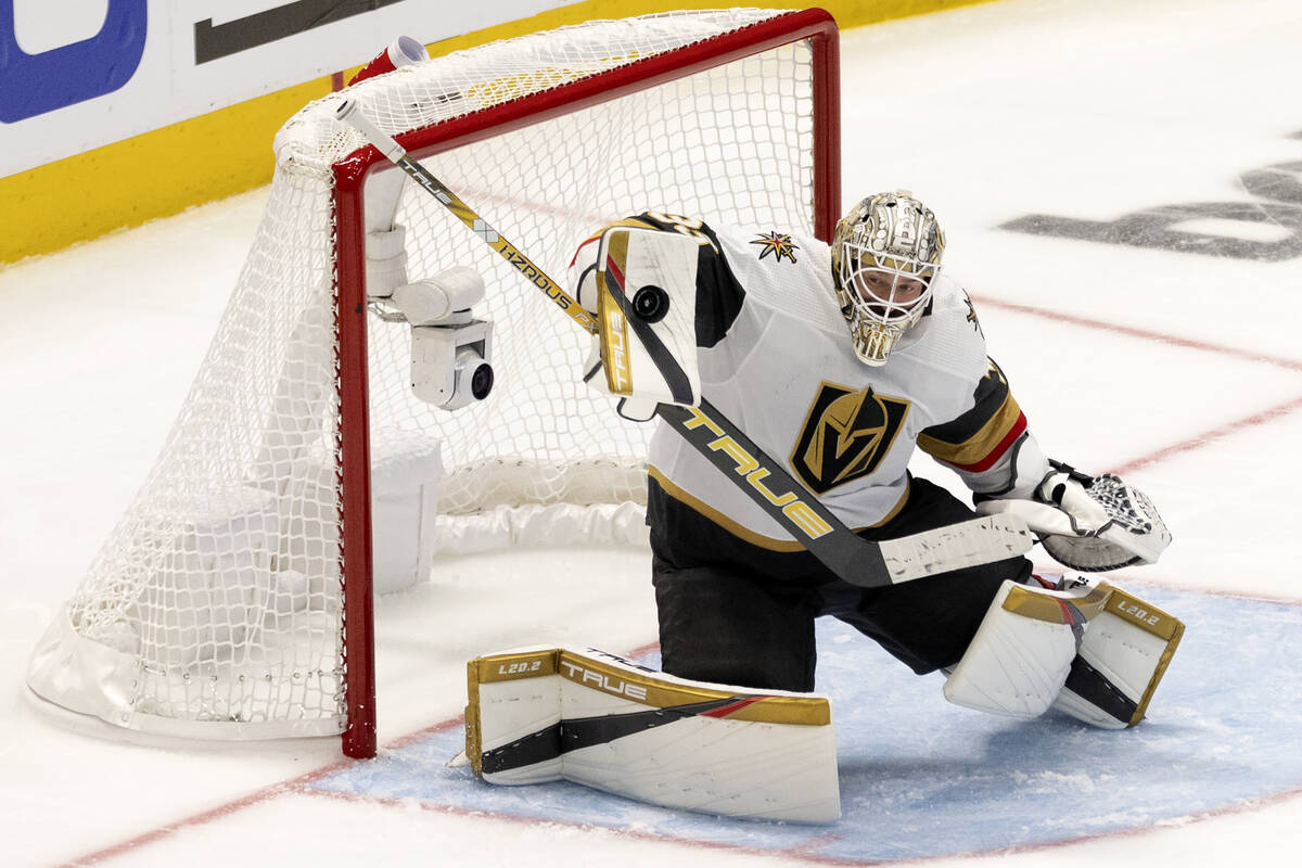 Golden Knights goaltender Adin Hill (33) saves the puck during the third period in Game 3 of th ...