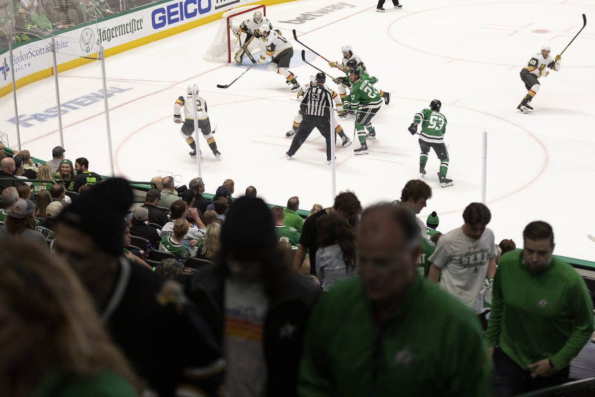 Dallas Stars fans leave the arena as their team is down 4-0 during the third period in Game 3 o ...