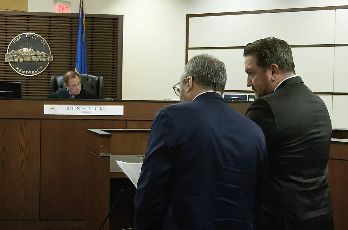Former Henderson police union president Gary Hargis, right, during a hearing at Henderson Justi ...