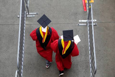 FILE - New graduates walk into the High Point Solutions Stadium before the start of the Rutgers ...