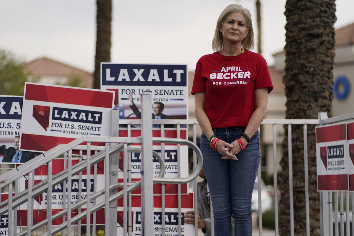 Republican congressional candidate April Becker waits to speak at a get-out-the-vote rally Satu ...