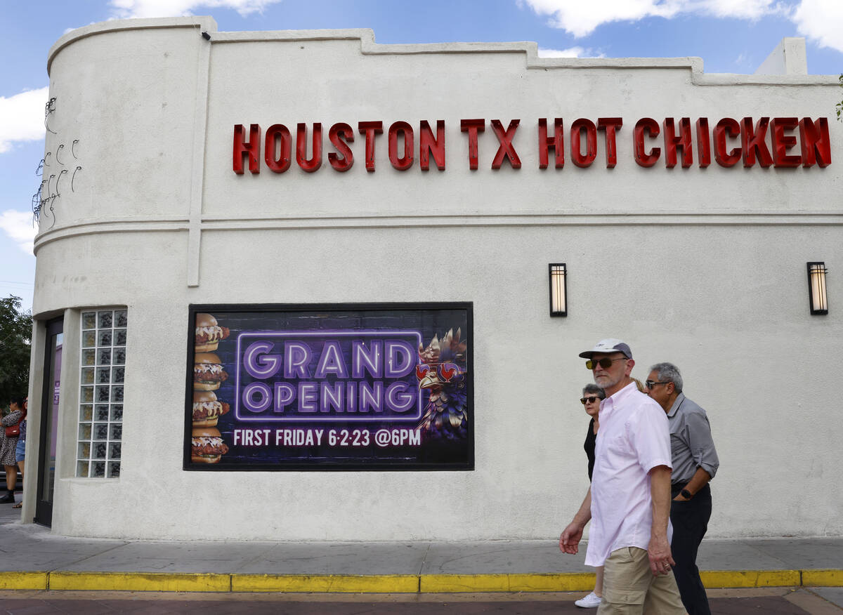 Pedestrians walk past the new Houston Hot Chicken at 1201 S Main St., in downtown Las Vegas, on ...