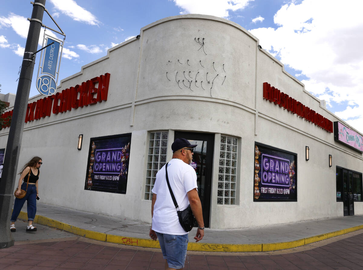 Pedestrians walk past the new Houston Hot Chicken at 1201 S Main St., in downtown Las Vegas, on ...