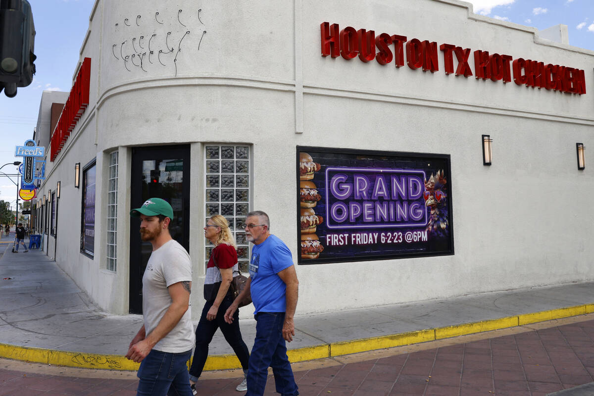Pedestrians walk past the new Houston Hot Chicken at 1201 S Main St., in downtown Las Vegas, on ...
