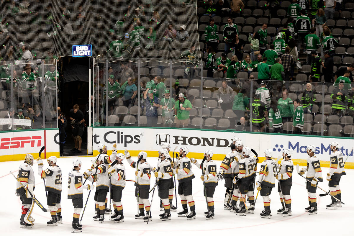 The Golden Knights gather to celebrate their win over the Dallas Stars in Game 3 of the NHL hoc ...