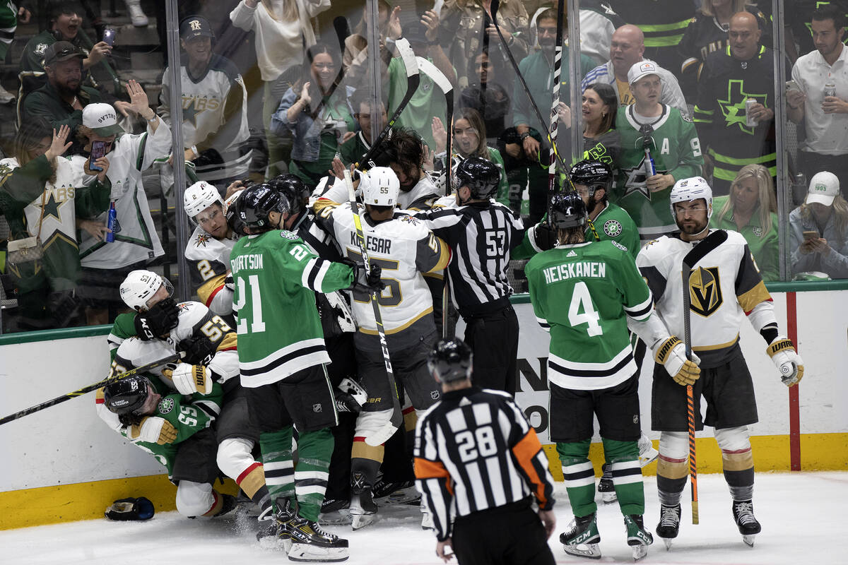 The Golden Knights and the Dallas Stars fight during the second period in Game 3 of the NHL hoc ...