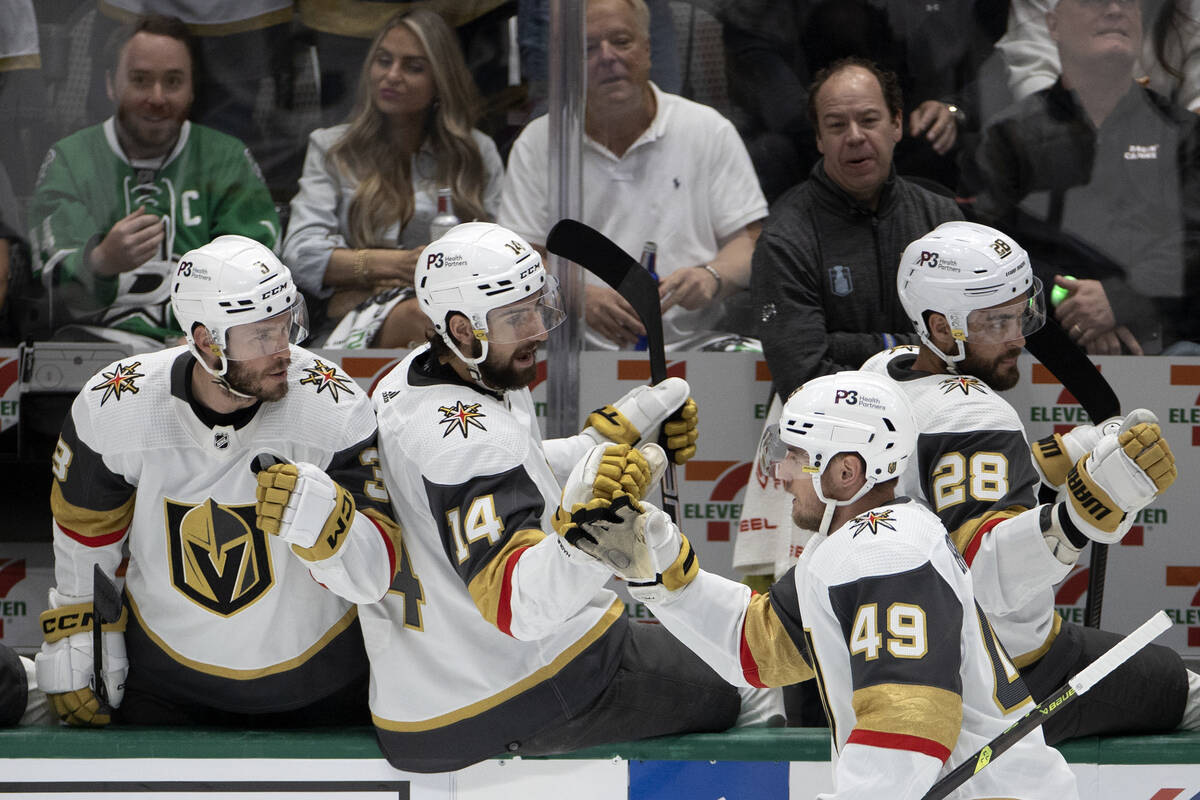 Golden Knights center Ivan Barbashev (49) is congratulated by the bench after he scored on the ...