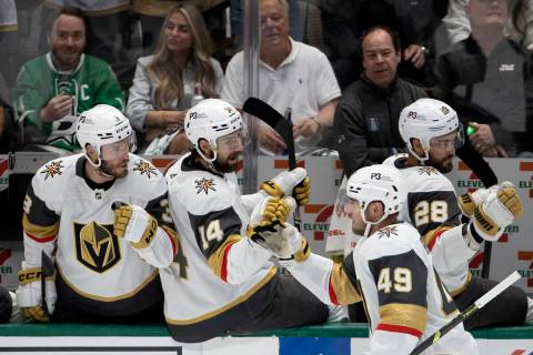 Golden Knights center Ivan Barbashev (49) is congratulated by the bench after he scored on the ...