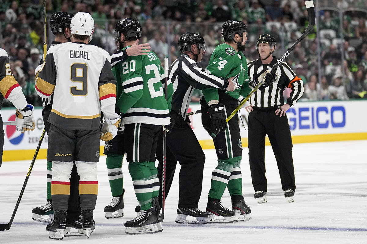 Dallas Stars left wing Jamie Benn, right, is escorted by officials as Vegas Golden Knights' Jac ...