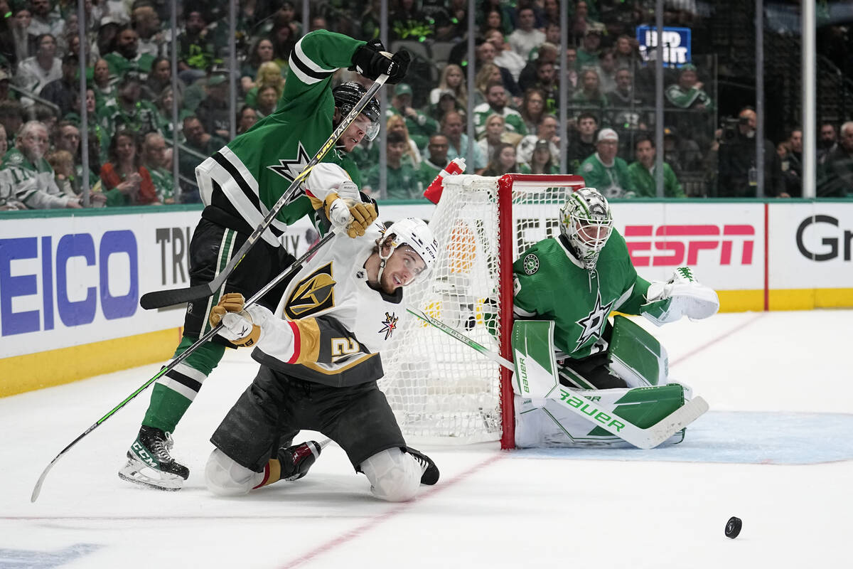 Dallas Stars defenseman Miro Heiskanen, left, and Vegas Golden Knights center Brett Howden (21) ...