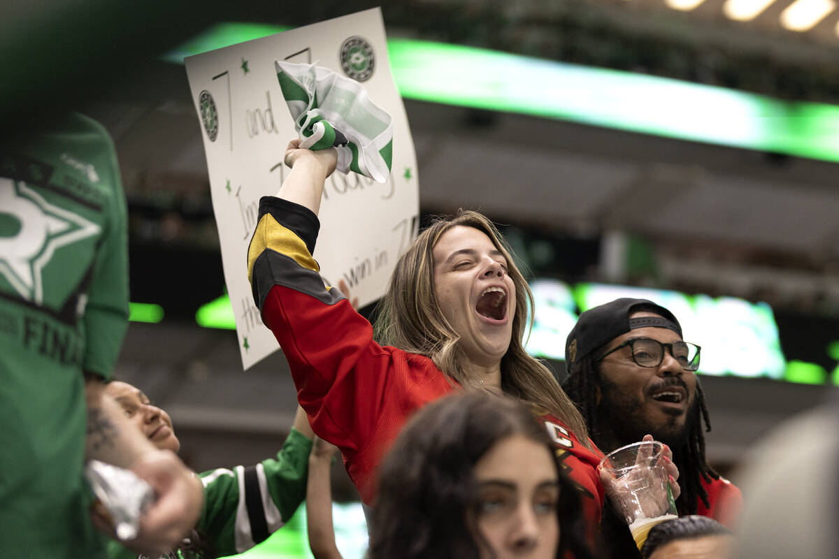 Golden Knights fans cheer after their team scored on the Dallas Stars during the first period i ...