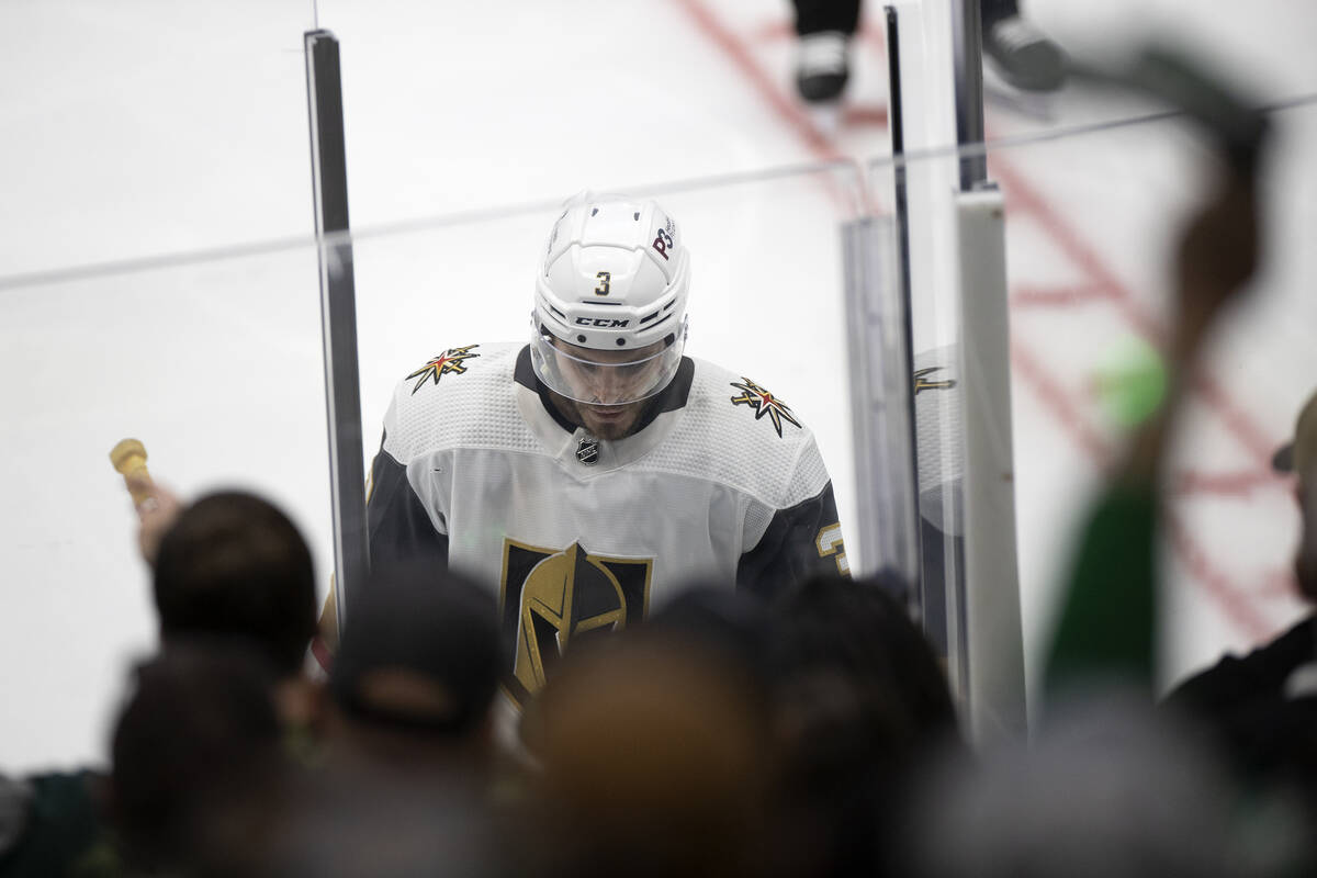Golden Knights defenseman Brayden McNabb (3) heads to the penalty box after referees assessed h ...