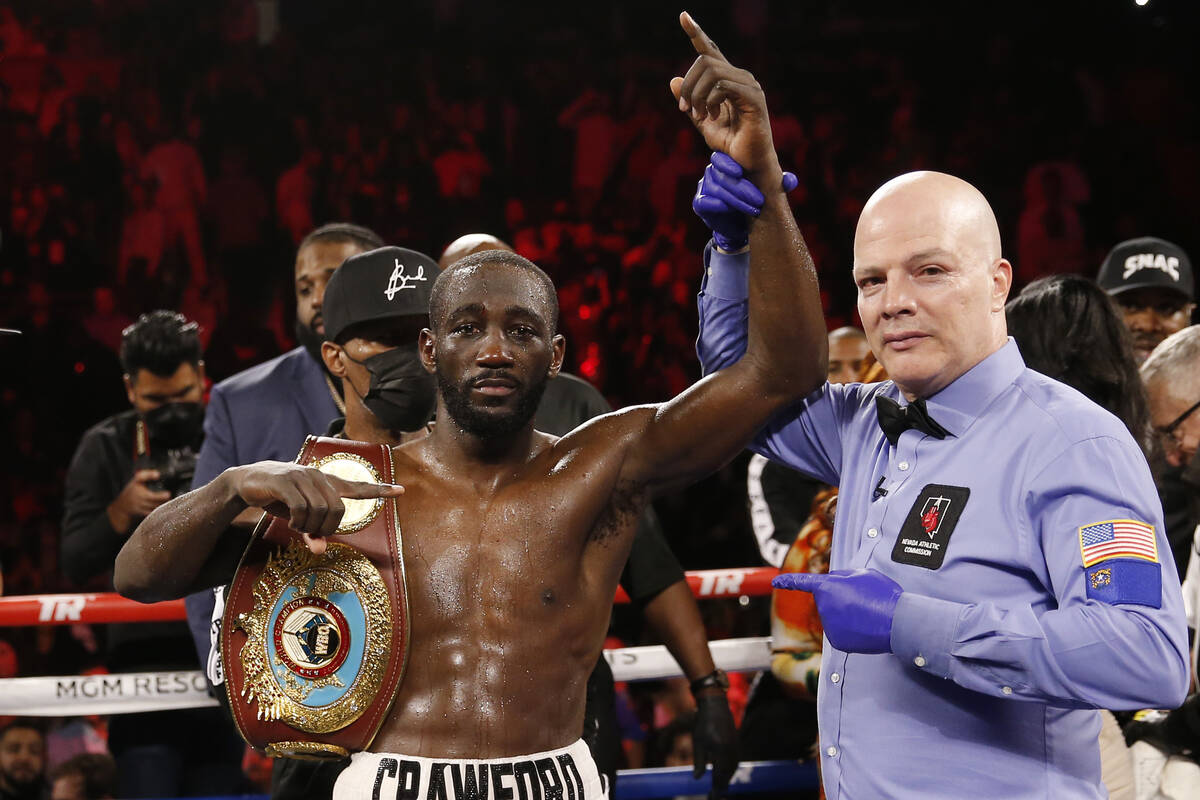 Terence Crawford poses for photographers after defeating Shawn Porter by TKO in a welterweight ...