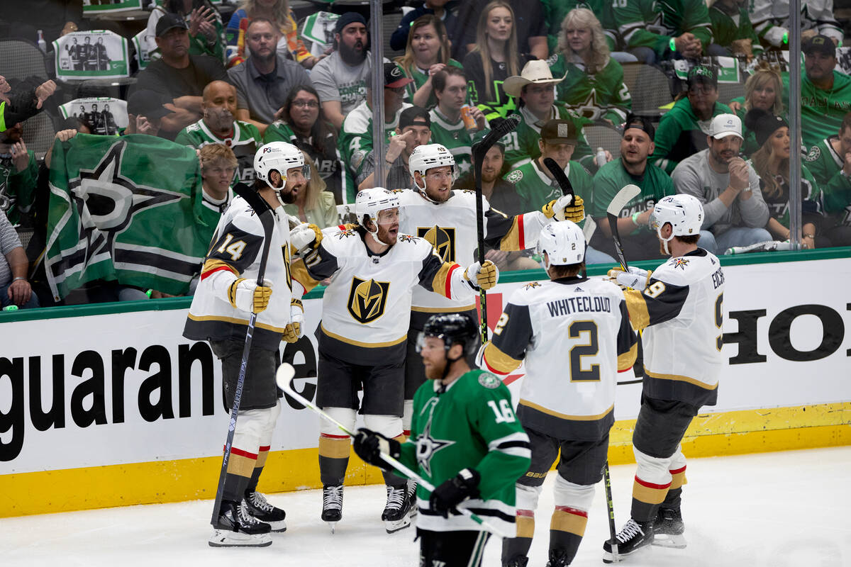 The Golden Knights celebrate after Golden Knights right wing Jonathan Marchessault, second from ...