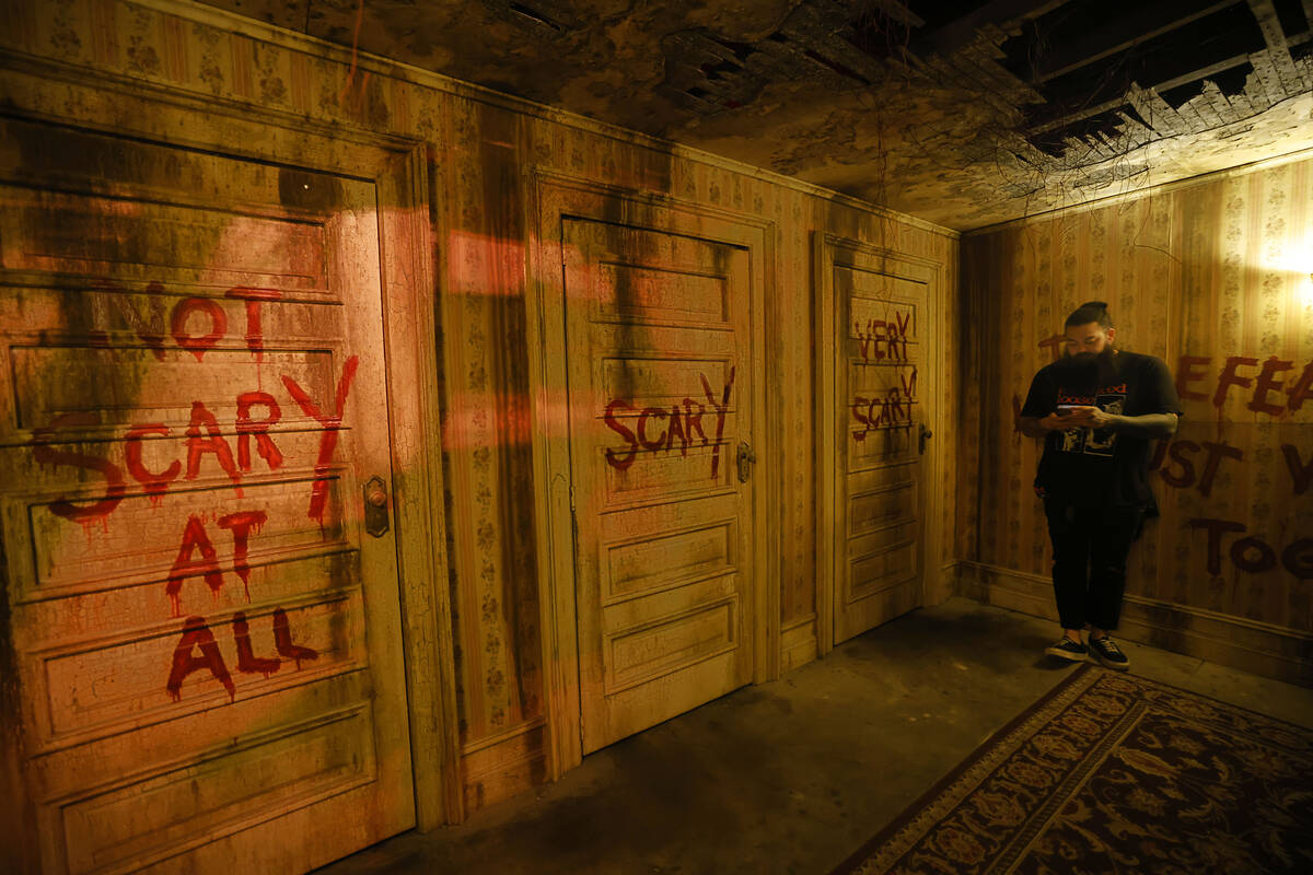 Justin Abundo, technical director of Escape IT, stands on the set of Three Doors at Escape IT, ...